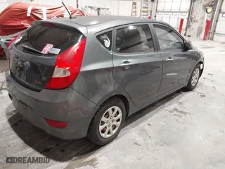 2013 Hyundai Accent GL with VIN KMHCT5AEXDU100208, listed as a IAAI auction lot 41517792 with 164,510 mi miles. Bid and sale history available at carsss.com. Image 4.