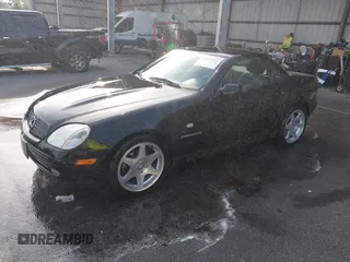 2000 Mercedes-Benz SLK-Class Kompressor with VIN WDBKK47F6YF165062, listed as a IAAI auction lot 42028279 with 105,707 mi miles. Bid and sale history available at carsss.com. Image 2.
