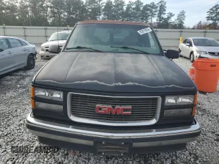 1999 GMC Yukon with VIN 1GKEC13R7XJ802387, listed as a Copart auction lot 82819934 with 438,574 mi miles and Salvage Title. Bid and sale history available at carsss.com. Image 5.