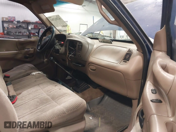1997 Ford F-150 with VIN 1FTDF1767VKC52713, listed as a IAAI auction lot 42212161 with 136,306 mi miles and . Bid and sale history available at DreamBid. Image 5.