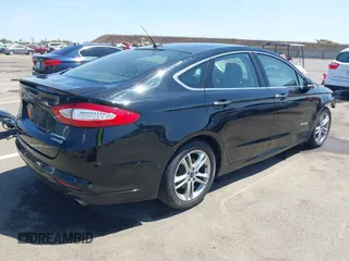 2016 Ford Fusion Titanium Hybrid z VIN 3FA6P0RUXGR123445, wystawiony jako IAAI lot #42606596 z przebiegiem 145 541 mil mil oraz . Historia ofert i sprzedaży dostępna na DreamBid. Obrazek 4.