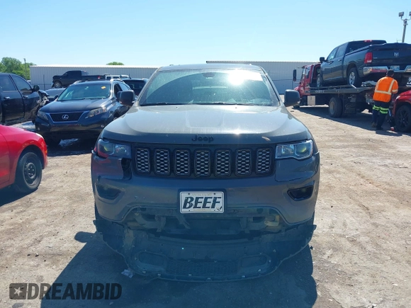 2019 Jeep Grand Cherokee Laredo E with VIN 1C4RJFAG8KC849782, listed as a IAAI auction lot 42151331 with 141,099 mi miles and . Bid and sale history available at DreamBid. Image 12.