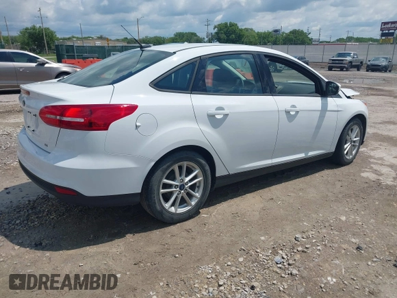 2016 Ford Focus SE z VIN 1FADP3F29GL346196, wystawiony jako IAAI lot #42171014 z przebiegiem 80 913 mil mil oraz . Historia ofert i sprzedaży dostępna na DreamBid. Obrazek 4.
