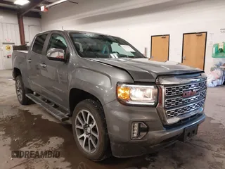 2021 GMC Canyon 4WD Denali with VIN 1GTG6EEN4M1287194, listed as a IAAI auction lot 41571729 with 21,704 mi miles. Bid and sale history available at carsss.com. Image 1.