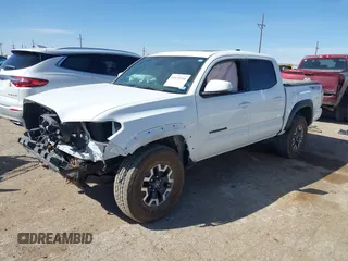 2023 Toyota Tacoma 4WD SR with VIN 3TMCZ5AN7PM653250, listed as a IAAI auction lot 41673534 with 19,496 mi miles. Bid and sale history available at carsss.com. Image 2.