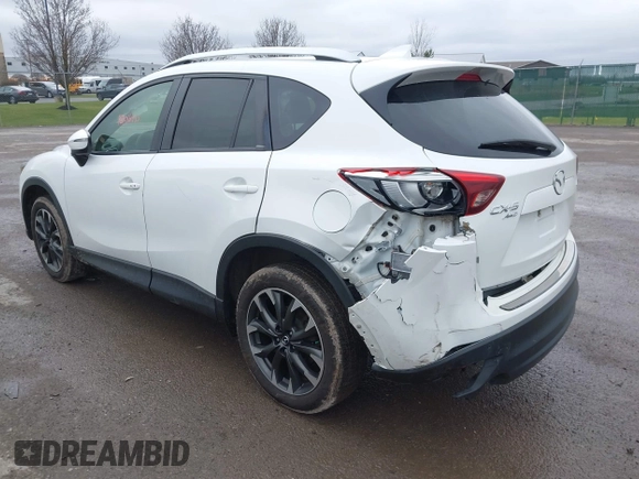 2016 Mazda CX-5 Grand Touring z VIN JM3KE4DY0G0705884, wystawiony jako IAAI lot #42016910 z przebiegiem 73 324 mil mil oraz . Historia ofert i sprzedaży dostępna na DreamBid. Obrazek 3.