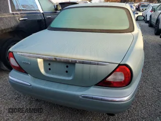 2005 Jaguar XJ with VIN SAJWA79C05SG37189, listed as a Copart auction lot 76804104 with 0 mi miles and Salvage Title. Bid and sale history available at carsss.com. Image 6.