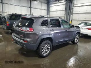 2020 Jeep Cherokee Trailhawk with VIN 1C4PJMBX9LD582951, listed as a Copart auction lot 60152935 with 61,448 mi miles and Salvage title. Bid and sale history available at DreamBid. Image 3.