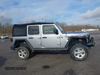 2020 Jeep Wrangler Unlimited Sport S with VIN 1C4HJXDG4LW221778, listed as a IAAI auction lot 41441662 with 76,026 mi miles and . Bid and sale history available at DreamBid. Image 13.