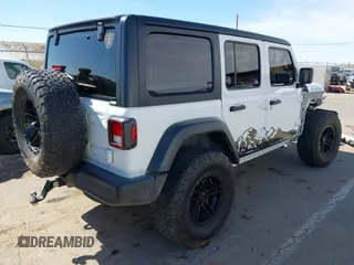 2020 Jeep Wrangler Unlimited Sport with VIN 1C4HJXDG0LW174393, listed as a IAAI auction lot 41575040 with 68,418 mi miles and . Bid and sale history available at DreamBid. Image 4.