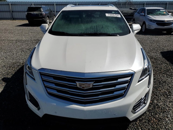 2019 Cadillac XT5 Luxury FWD z VIN 1GYKNCRS6KZ271427, wystawiony jako Copart lot #58873725 z przebiegiem Nie podano mil oraz Szkoda całkowita • Salvage title. Historia ofert i sprzedaży dostępna na DreamBid. Obrazek 5.