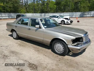 1991 Mercedes-Benz 560 with VIN WDBCA39E9MA599487, listed as a Copart auction lot 51921915 with 59,132 mi miles and Salvage Title. Bid and sale history available at DreamBid. Image 4.