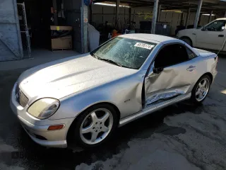 2002 Mercedes-Benz SLK-Class 2.3L Kompressor with VIN WDBKK49FX2F268683, listed as a Copart auction lot 68705174 with 132,677 mi miles and Salvage Title. Bid and sale history available at carsss.com. Image 1.