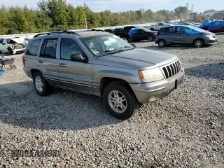 1999 Jeep Grand Cherokee Limited with VIN 1J4G268S7XC668348, listed as a Copart auction lot 77824084 with 165,779 mi miles and Salvage title. Bid and sale history available at DreamBid. Image 12.