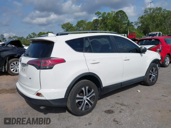 2017 Toyota RAV4 LE with VIN JTMZFREV3HJ143416, listed as a IAAI auction lot 41861981 with 115,241 mi miles and . Bid and sale history available at DreamBid. Image 4.