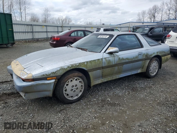 1988 Toyota Supra with VIN JT2MA70J7J0097790, listed as a Copart auction lot 50250145 with 131,411 mi miles and Clean title. Bid and sale history available at DreamBid. Image 1.
