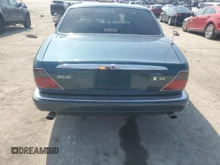 1996 Jaguar XJ z VIN SAJHX1746TC756451, wystawiony jako Copart lot #48991655 z przebiegiem 115 015 mil mil oraz Szkoda całkowita • Salvage title. Historia ofert i sprzedaży dostępna na DreamBid. Obrazek 6.