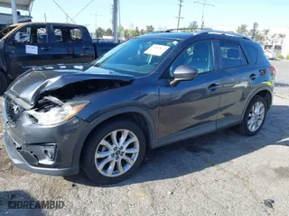 2014 Mazda CX-5 Grand Touring with VIN JM3KE2DY7E0405115, listed as a IAAI auction lot 41939899 with 147,452 mi miles. Bid and sale history available at carsss.com. Image 2.