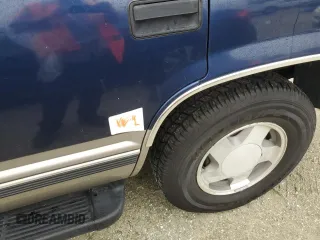 1999 GMC Yukon with VIN 1GKEK13R2XJ739931, listed as a Copart auction lot 74583734 with 115,605 mi miles and Salvage Title. Bid and sale history available at carsss.com. Image 13.