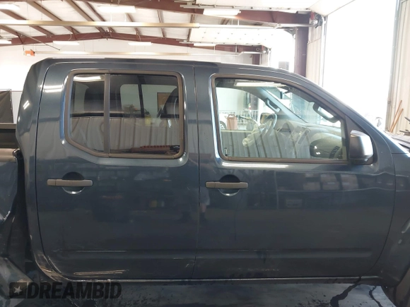 2015 Nissan Frontier Pro-4X with VIN 1N6AD0EV6FN735426, listed as a IAAI auction lot 42596253 with 183,493 mi miles and . Bid and sale history available at DreamBid. Image 14.