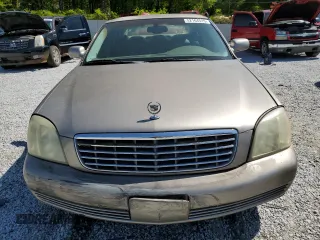 2003 Cadillac DeVille z VIN 1G6KD54Y63U250482, wystawiony jako Copart lot #52164515 z przebiegiem 131 376 mil mil oraz Szkoda całkowita • Salvage title. Historia ofert i sprzedaży dostępna na DreamBid. Obrazek 5.