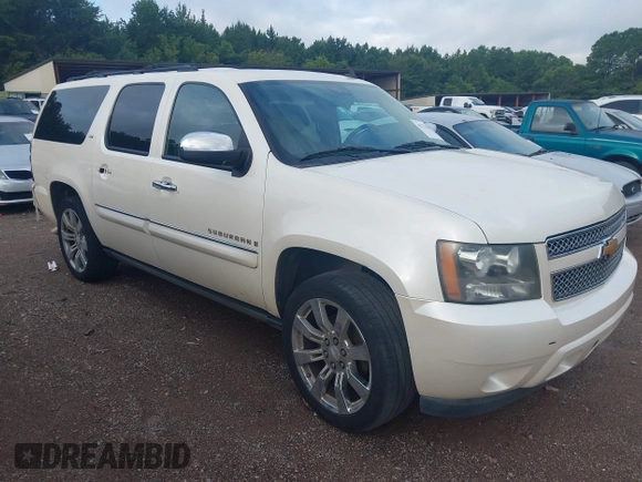 2008 Chevrolet Suburban LTZ z VIN 1GNFC160X8R221599, wystawiony jako IAAI lot #42774069 z przebiegiem 135 406 mil mil oraz . Historia ofert i sprzedaży dostępna na DreamBid. Obrazek 1.