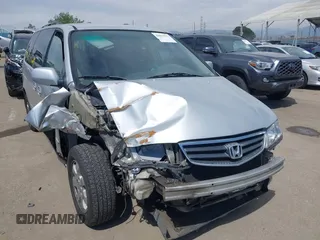 2003 Honda Odyssey EX z VIN 5FNRL18623B077858, wystawiony jako IAAI lot #42011273 z przebiegiem 141 709 mil mil oraz . Historia ofert i sprzedaży dostępna na DreamBid. Obrazek 1.