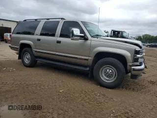 1999 Chevrolet Suburban with VIN 1GNGK26J0XJ439859, listed as a Copart auction lot 69076004 with 277,201 mi miles and Salvage Title. Bid and sale history available at carsss.com. Image 4.