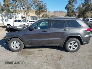 2017 Jeep Grand Cherokee Laredo with VIN 1C4RJEAG8HC944037, listed as a IAAI auction lot 41299619 with 140,405 mi miles. Bid and sale history available at carsss.com. Image 14.