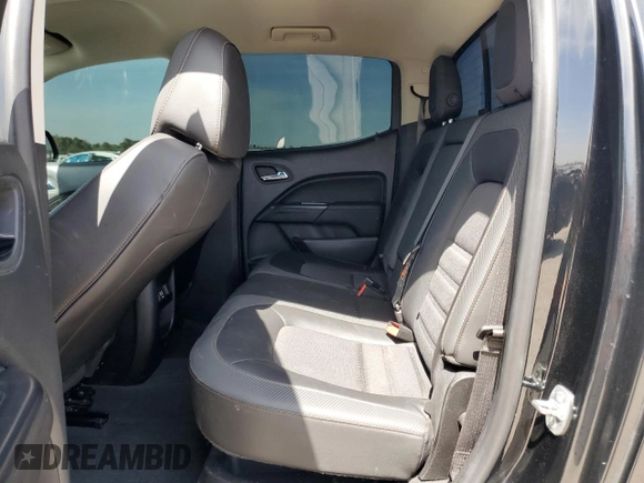 2021 GMC Canyon 4WD AT4 w/Leather with VIN 1GTG6FEN3M1274409, listed as a Copart auction lot 49228145 with 57,194 mi miles and Salvage Title. Bid and sale history available at carsss.com. Image 10.