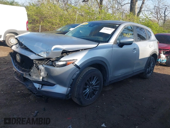 2020 Mazda CX-5 Touring with VIN JM3KFACM5L0766698, listed as a IAAI auction lot 42006157 with 80,288 mi miles and . Bid and sale history available at carsss.com. Image 2.