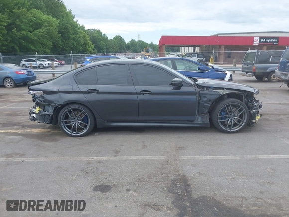 2018 BMW 5 Series M550i xDrive with VIN WBAJB9C56JB035364, listed as a IAAI auction lot 42179145 with 112,123 mi miles and . Bid and sale history available at DreamBid. Image 14.