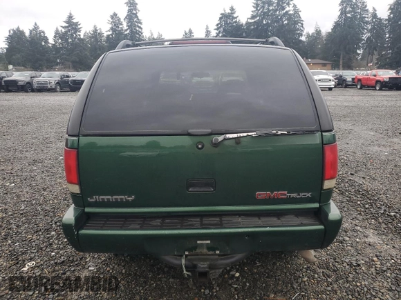 1997 GMC Jimmy SLS with VIN 1GKDT13WXV2563104, listed as a Copart auction lot 86317834 with 121,791 mi miles and Salvage Title. Bid and sale history available at carsss.com. Image 6.
