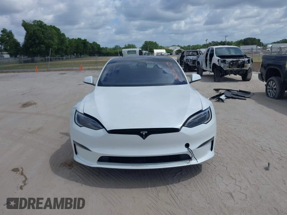 2022 Tesla Model S Plaid with VIN 5YJSA1E6XNF473888, listed as a IAAI auction lot 42141141 with 28,584 mi miles and . Bid and sale history available at carsss.com. Image 12.