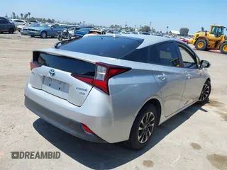 2022 Toyota Prius L Eco with VIN JTDKAMFU5N3188107, listed as a IAAI auction lot 42223649 with 180,894 mi miles and . Bid and sale history available at DreamBid. Image 4.