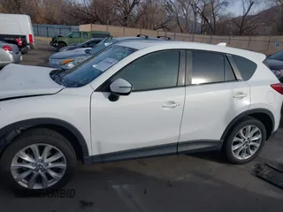 2015 Mazda CX-5 Grand Touring with VIN JM3KE4DY3F0483629, listed as a IAAI auction lot 41054059 with 118,980 mi miles. Bid and sale history available at carsss.com. Image 13.