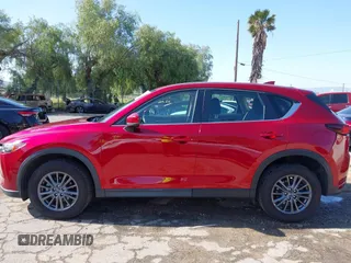 2019 Mazda CX-5 Sport with VIN JM3KFABM0K1633065, listed as a IAAI auction lot 41968786 with 90,407 mi miles and . Bid and sale history available at DreamBid. Image 14.