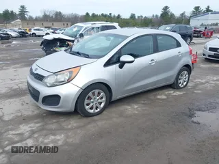 2012 Kia Rio LX with VIN KNADM5A36C6040934, listed as a IAAI auction lot 41970914 with 121,405 mi miles. Bid and sale history available at carsss.com. Image 2.