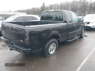 2002 Ford F-150 XL with VIN 1FTRX17W92NA80214, listed as a IAAI auction lot 41074951 with 164,048 mi miles. Bid and sale history available at carsss.com. Image 4.
