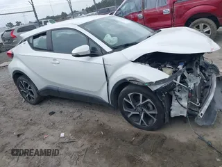 2018 Toyota C-HR XLE z VIN NMTKHMBX2JR024932, wystawiony jako IAAI lot #41916549 z przebiegiem 83 293 mil mil oraz . Historia ofert i sprzedaży dostępna na DreamBid. Obrazek 1.