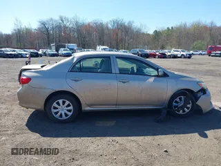 2009 Toyota Corolla with VIN 1NXBU40E09Z144942, listed as a IAAI auction lot 42051178 with 101,564 mi miles and . Bid and sale history available at DreamBid. Image 13.