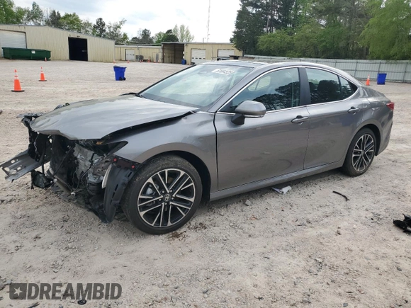 2025 Toyota Camry LE with VIN 4T1DAACKXSU556874, listed as a Copart auction lot 52694525 with 7,076 mi miles and Salvage Title. Bid and sale history available at carsss.com. Image 1.