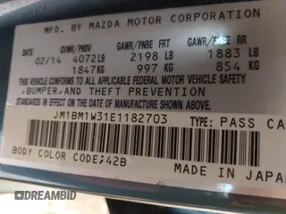 2014 Mazda 3 S Grand Touring with VIN JM1BM1W31E1182703, listed as a IAAI auction lot 41470742 with 123,956 mi miles and . Bid and sale history available at DreamBid. Image 9.