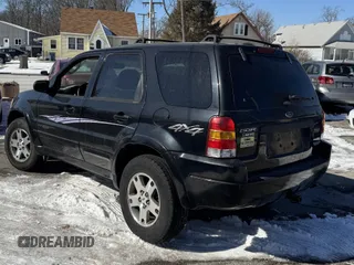 2004 Ford Escape Limited with VIN 1FMCU94144KA88842, listed as a IAAI auction lot 41643194 with 148,082 mi miles. Bid and sale history available at carsss.com. Image 3.