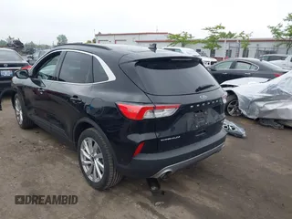 2021 Ford Escape Titanium Hybrid with VIN 1FMCU9DZ5MUA18079, listed as a IAAI auction lot 42340093 with 71,630 mi miles and . Bid and sale history available at DreamBid. Image 3.