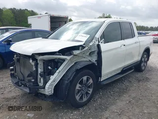 2019 Honda Ridgeline RTL-E with VIN 5FPYK3F78KB018356, listed as a IAAI auction lot 41946363 with 61,472 mi miles and . Bid and sale history available at DreamBid. Image 18.