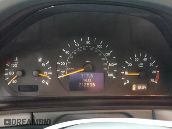 2000 Mercedes-Benz E-Class with VIN WDBJF82J1YX030388, listed as a Copart auction lot 86384974 with 212,596 mi miles and Salvage Title. Bid and sale history available at carsss.com. Image 9.