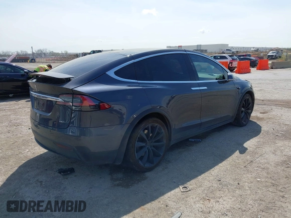 2017 Tesla Model X 90D with VIN 5YJXCBE22HF079194, listed as a IAAI auction lot 41895591 with 102,437 mi miles and . Bid and sale history available at DreamBid. Image 4.