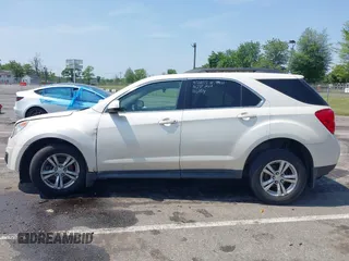 2015 Chevrolet Equinox LT z VIN 1GNALBEK9FZ115113, wystawiony jako IAAI lot #42402174 z przebiegiem 146 666 mil mil oraz . Historia ofert i sprzedaży dostępna na DreamBid. Obrazek 14.