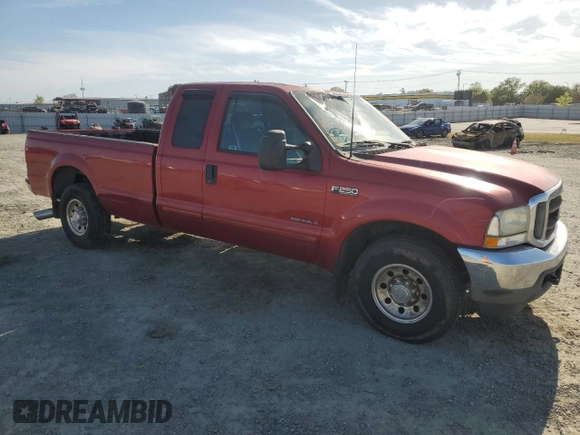 2002 Ford F-250 XL with VIN 1FTNX20F02EB64128, listed as a Copart auction lot 51979895 with 162,117 mi miles and Salvage title. Bid and sale history available at DreamBid. Image 4.